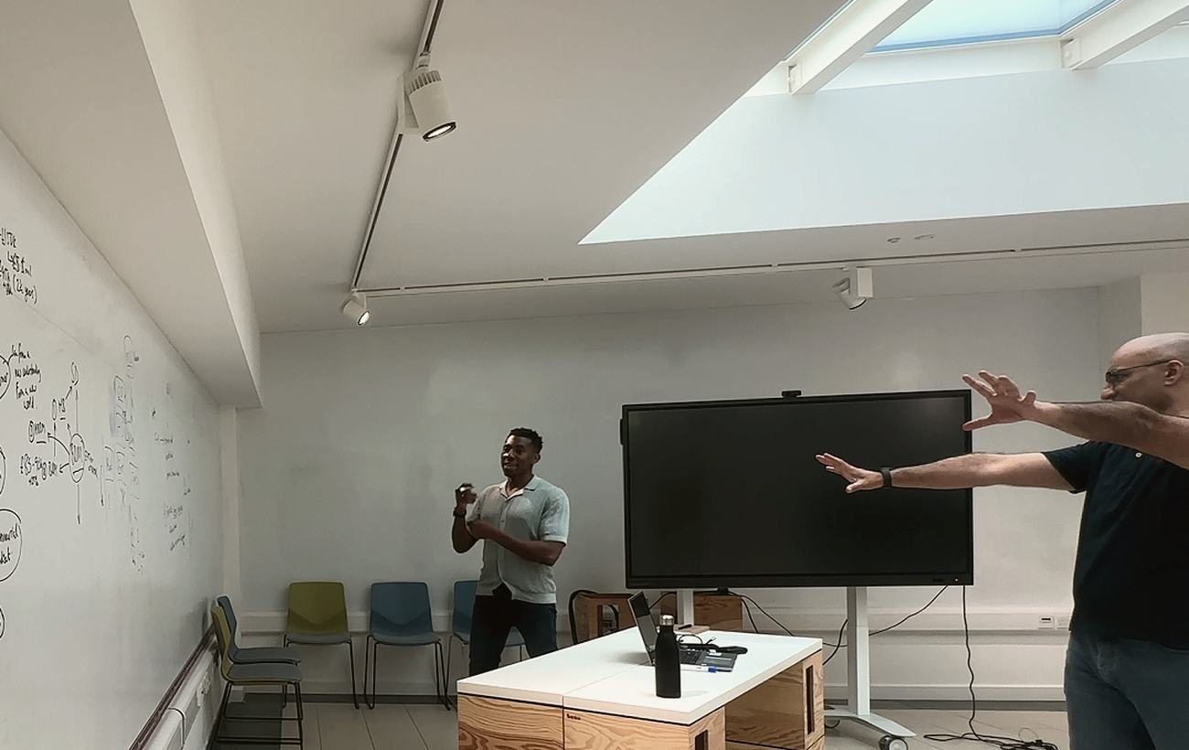 A session room, the whiteboard covered in working notes.
